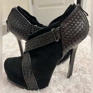 High heels with platforms black with leather straps. Bebe brand. Like new